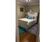 Cozy bedroom with a full bed, colorful decor, and hardwood floors at 220 N Springs Ct, Sandy Springs, GA 30328