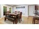 Cozy dining area featuring hardwood floors, built-in storage, and access to a screened-in porch at 220 N Springs Ct, Sandy Springs, GA 30328