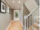Inviting foyer with hardwood floors, staircase, and a door with glass panes at 220 N Springs Ct, Sandy Springs, GA 30328