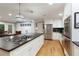 Spacious kitchen with large island, stainless steel appliances, and hardwood floors at 220 N Springs Ct, Sandy Springs, GA 30328