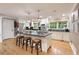 Bright kitchen with white cabinets, stainless steel appliances, and a large center island at 220 N Springs Ct, Sandy Springs, GA 30328