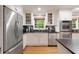 Well-equipped kitchen with stainless steel appliances and white cabinetry at 220 N Springs Ct, Sandy Springs, GA 30328