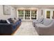 Comfortable living room featuring hardwood floors, neutral paint, and a large window at 220 N Springs Ct, Sandy Springs, GA 30328