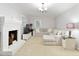 Comfortable living room with a brick fireplace and neutral decor at 220 N Springs Ct, Sandy Springs, GA 30328