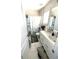 Bright bathroom with white cabinets, vanity, floral shower curtain, and tile flooring for a clean aesthetic at 2532 Greenes Ln, Powder Springs, GA 30127