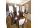 Formal dining room with hardwood floors, large table, and elegant chandelier at 2532 Greenes Ln, Powder Springs, GA 30127