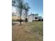 Picturesque view of the home exterior, showcasing the backyard with mature trees and landscaping at 2532 Greenes Ln, Powder Springs, GA 30127