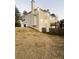 Well-maintained home exterior with a spacious backyard and a charming wooden fence at 2532 Greenes Ln, Powder Springs, GA 30127