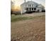 Inviting home with a cozy porch and beautifully landscaped front yard, perfect for relaxing evenings at 2532 Greenes Ln, Powder Springs, GA 30127