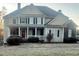 Charming two-story home with a welcoming front porch and well-maintained landscaping at 2532 Greenes Ln, Powder Springs, GA 30127