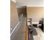 Spacious loft overlooking the living area, featuring hardwood floors and a cozy fireplace at 2532 Greenes Ln, Powder Springs, GA 30127
