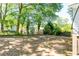 Large backyard is shaded by mature trees, offering a peaceful and private outdoor space at 3273 Elm St, Atlanta, GA 30337