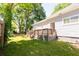 Exterior backyard view featuring a wooden deck, complemented by a well-manicured lawn at 3273 Elm St, Atlanta, GA 30337
