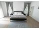 Bright and airy bedroom showcasing hardwood floors, neutral tones and lots of light at 3273 Elm St, Atlanta, GA 30337