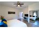 Bright bedroom featuring a ceiling fan, closet and desk with a TV at 3273 Elm St, Atlanta, GA 30337