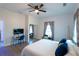Bright bedroom featuring a ceiling fan, closet and desk with a TV at 3273 Elm St, Atlanta, GA 30337