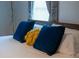 Tastefully decorated bed offers a cozy space with plush pillows and a serene atmosphere at 3273 Elm St, Atlanta, GA 30337