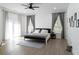 Bright bedroom with ample natural light, neutral color scheme, and ceiling fan at 3273 Elm St, Atlanta, GA 30337