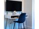 Close up of desk featuring marble, gold legs and a navy chair at 3273 Elm St, Atlanta, GA 30337