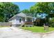 Charming single-story home featuring a cozy front porch and a well-maintained yard at 3273 Elm St, Atlanta, GA 30337