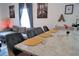 Open-concept kitchen and living room with countertop seating and comfortable sofa at 3273 Elm St, Atlanta, GA 30337