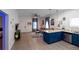 Open-concept living area with modern kitchen, cozy seating, and stylish decor at 3273 Elm St, Atlanta, GA 30337