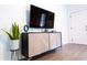 Stylish cabinet with decorative accents and a mounted flat screen TV at 3273 Elm St, Atlanta, GA 30337
