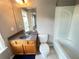 Bathroom featuring a tiled floor, vanity, sink, toilet, and tub with shower at 790 Village Field Ct, Suwanee, GA 30024