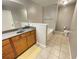 Bathroom featuring tile flooring, granite countertops, and neutral paint at 790 Village Field Ct, Suwanee, GA 30024