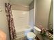 Well-lit bathroom featuring a shower and ceramic tile flooring at 790 Village Field Ct, Suwanee, GA 30024