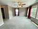 Bedroom boasts plush carpeting, lots of natural light, and a ceiling fan at 790 Village Field Ct, Suwanee, GA 30024