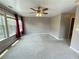Bedroom features plush carpeting, three windows bringing in light, and a ceiling fan at 790 Village Field Ct, Suwanee, GA 30024