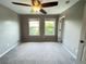 Bedroom with neutral walls, carpeted floors, a lighted ceiling fan, and natural light from two windows at 790 Village Field Ct, Suwanee, GA 30024