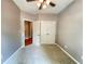 Inviting bedroom with carpet flooring, ceiling fan, and closet at 790 Village Field Ct, Suwanee, GA 30024