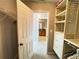Walk-in closet featuring custom organizers and access to the Primary bathroom at 790 Village Field Ct, Suwanee, GA 30024