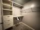 Spacious closet featuring custom organizers, drawers, and shelving for optimal storage at 790 Village Field Ct, Suwanee, GA 30024