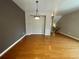 Dining area with hardwood floors and modern light fixture, plenty of space for a large table at 790 Village Field Ct, Suwanee, GA 30024