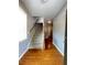 Inviting entryway with hardwood floors, staircase, and natural light at 790 Village Field Ct, Suwanee, GA 30024