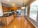 Modern kitchen with granite countertops, stainless steel appliances, and great lighting at 790 Village Field Ct, Suwanee, GA 30024