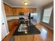 Well-lit kitchen featuring granite countertops, stainless steel appliances, and ample cabinet space at 790 Village Field Ct, Suwanee, GA 30024