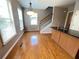 Kitchen featuring center island, wood floors, natural light and staircase access at 790 Village Field Ct, Suwanee, GA 30024
