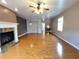 Bright living room featuring hardwood floors and a fireplace perfect for relaxing and entertaining at 790 Village Field Ct, Suwanee, GA 30024