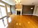 Spacious living room with a fireplace and hardwood floors, great for entertaining at 790 Village Field Ct, Suwanee, GA 30024