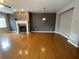 Bright living room with hardwood floors and a cozy fireplace perfect for relaxing and entertaining at 790 Village Field Ct, Suwanee, GA 30024