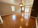Inviting living room with hardwood floors, a fireplace, and natural light creating a warm atmosphere at 790 Village Field Ct, Suwanee, GA 30024