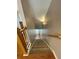 Carpeted staircase with wooden railing provides safe and stylish access to upper or lower floors at 790 Village Field Ct, Suwanee, GA 30024