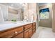 Bathroom featuring wood cabinets, white counter top, and tile flooring at 1294 Red Rock Rd, Acworth, GA 30101