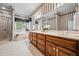 Bathroom featuring double vanity sinks, soaking tub, and tile flooring for an elegant design at 1294 Red Rock Rd, Acworth, GA 30101