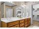 Bathroom featuring double vanity sinks and a walk-in closet for ample storage and convenience at 1294 Red Rock Rd, Acworth, GA 30101
