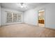 Bright bedroom with large window and doorway to the ensuite bathroom featuring dual sinks at 1294 Red Rock Rd, Acworth, GA 30101
